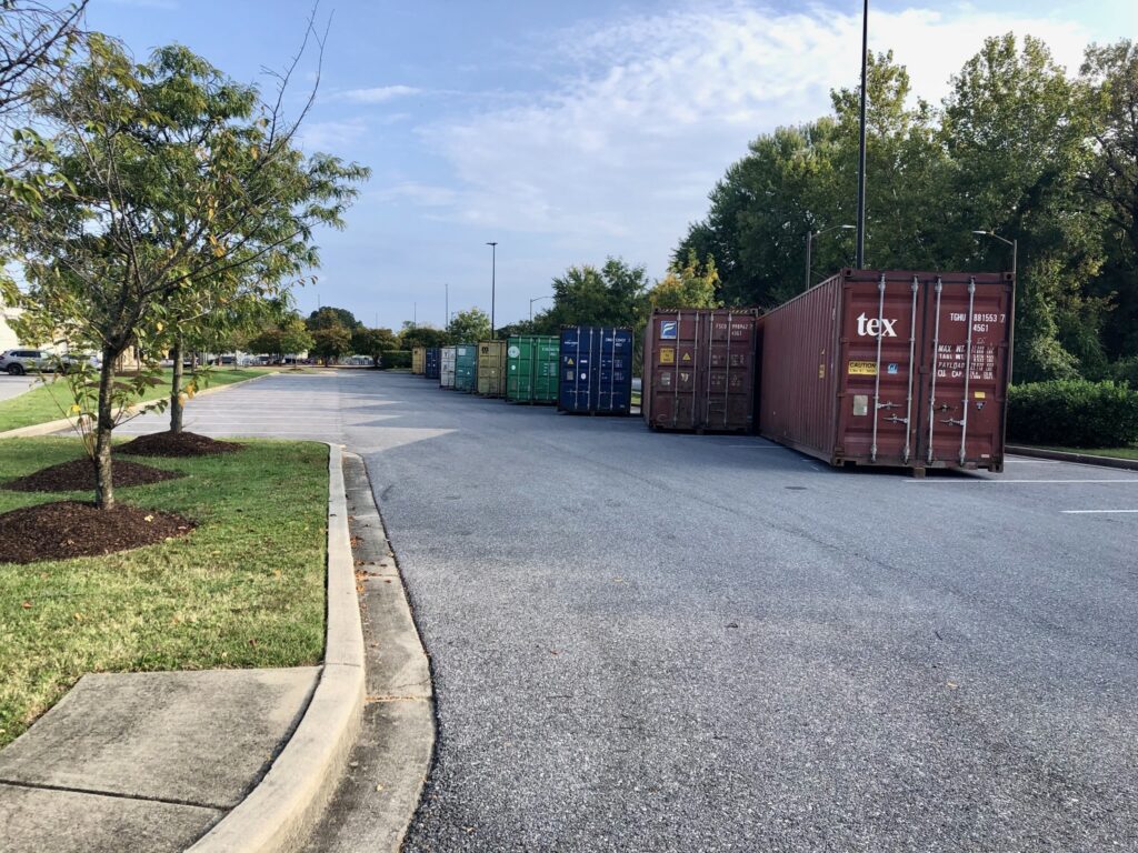 Forklift positioning Stellar Container Rentals portable storage container during commercial delivery and setup