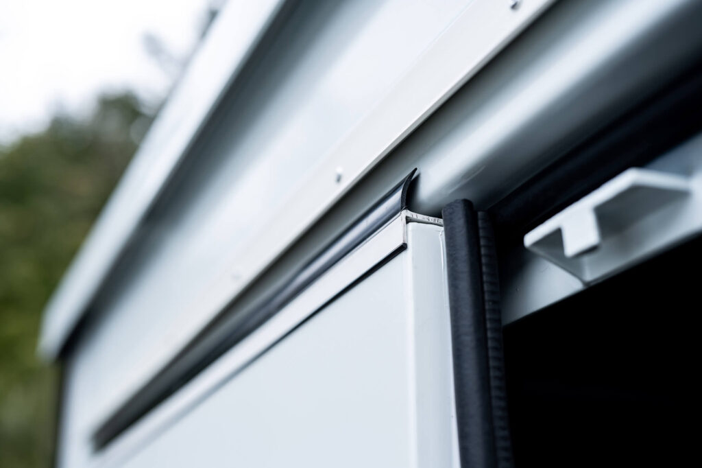 Close-up of truck camper shell seam.