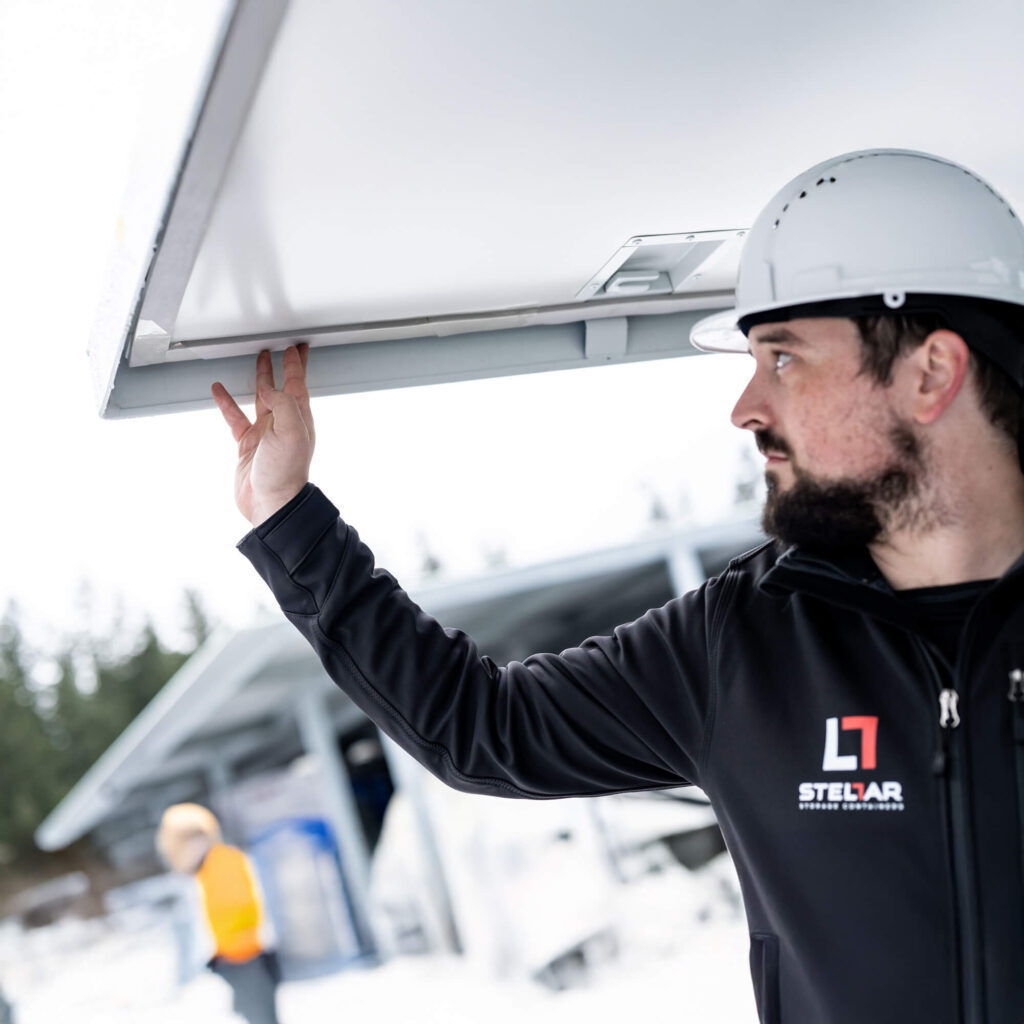 Engineer inspecting solar panel installation.
