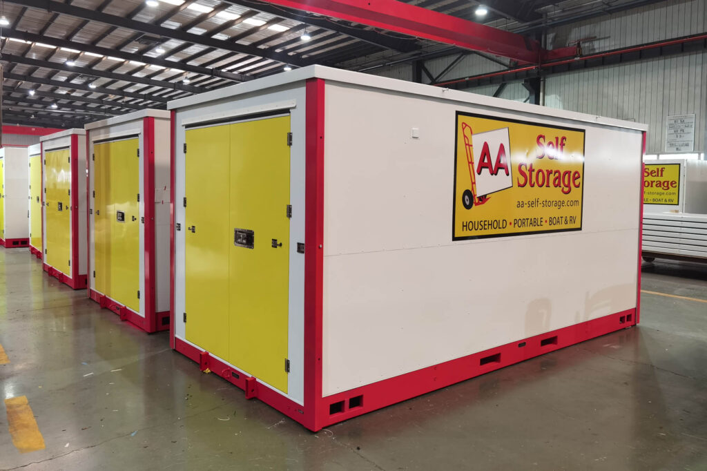 Yellow and red portable storage units in warehouse.
