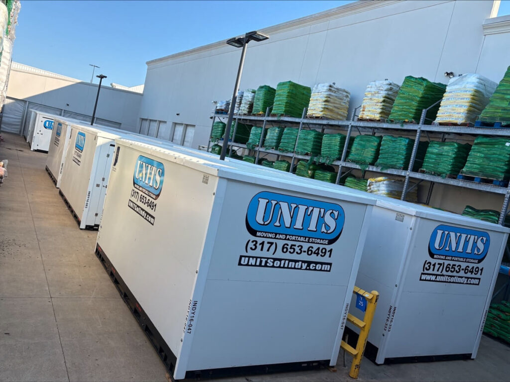 Aerial view of Stellar Container Rentals containers being transported and installed at commercial warehouse facility